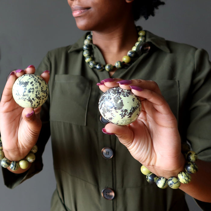 woman holding and wearing serpentine