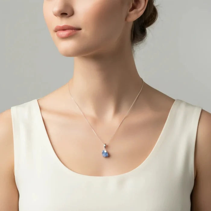 Sterling Silver and Dumortierite Pendant necklace on a lady's neck.