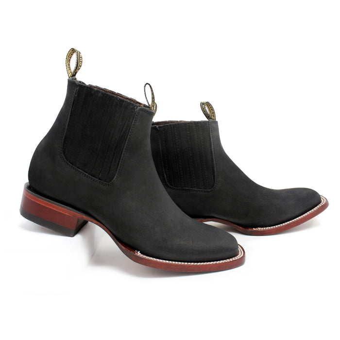Side view of men’s Los Altos black nobuck ankle boots with leather sole and elastic panels.