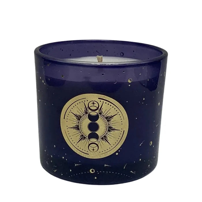 Purple candle with gold celestial design on a white background