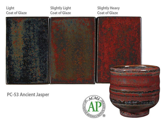 Amaco PC-53 Ancient Jasper glaze on three test tiles from light to slightly heavy coat, black to rust red, with a cup