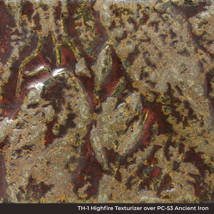 Close-up of TH-1 Highfire Texturizer over PC-53 Ancient Jasper glaze, mottled and pitted red, gold and olive surface