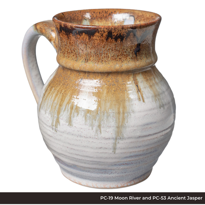Mug in PC-19 Moon River and PC-53 Ancient Jasper glazes, speckled amber neck dripping over a white ribbed body