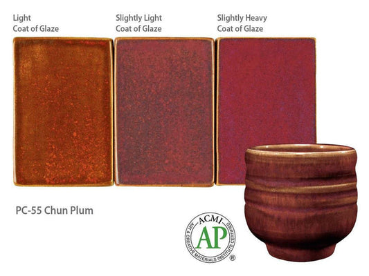 PC-55 Chun Plum glaze test tiles at light to slightly heavy coats, rust-orange to plum red, with a ribbed red-brown cup