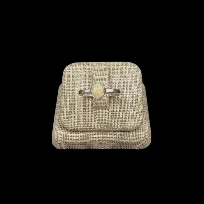 Front View Of Sterling Silver Opal Gemstone Ring A Iridescent White With A Rainbow Of Colors Throughout It
