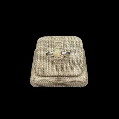 Front View Of Sterling Silver Opal Gemstone Ring A Iridescent White With A Rainbow Of Colors Throughout It