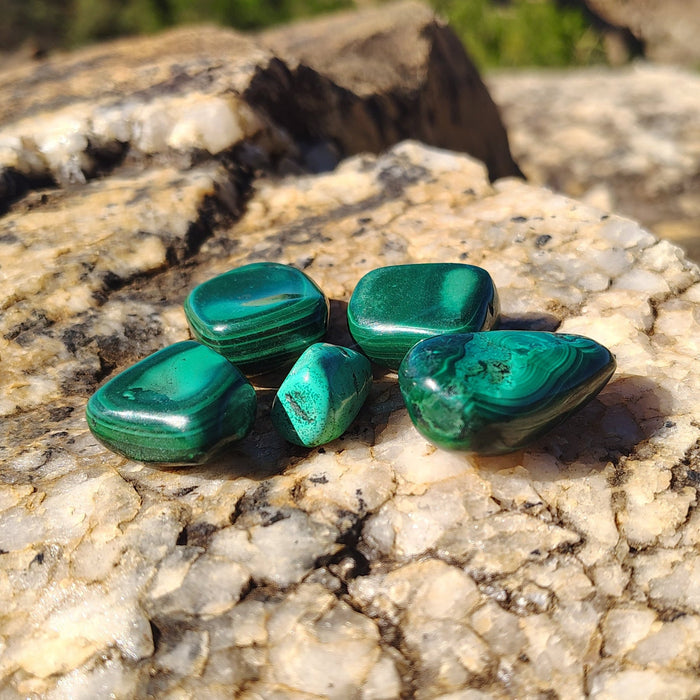 This is all the malachite stones included in this set in natural light.