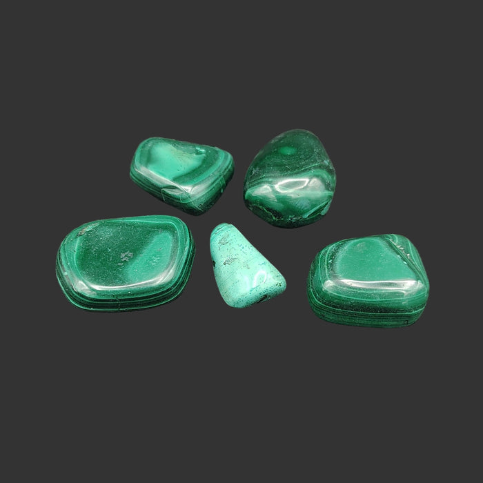 This is all the malachite stones included in this set, in artificial light.